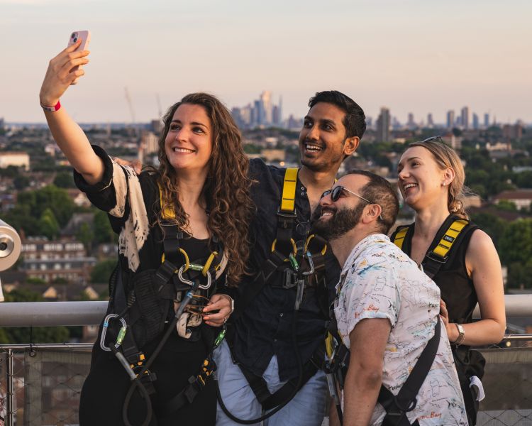 visitors taking selfies on the tottenham hotspur skywalk experience in london