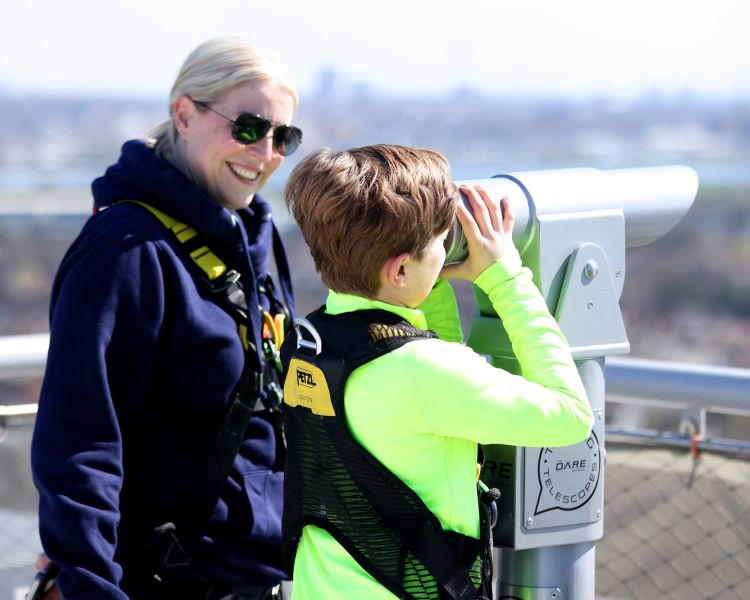 visitors looking through telescopes at the views on the tottenham hotspur skywalk experience in london