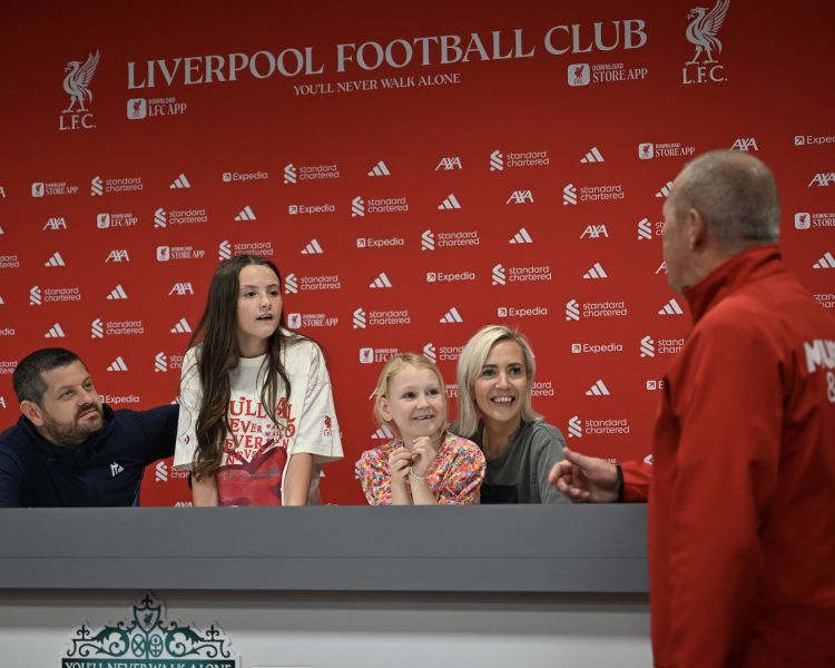 family in the press room on liverpool fc stadium tour