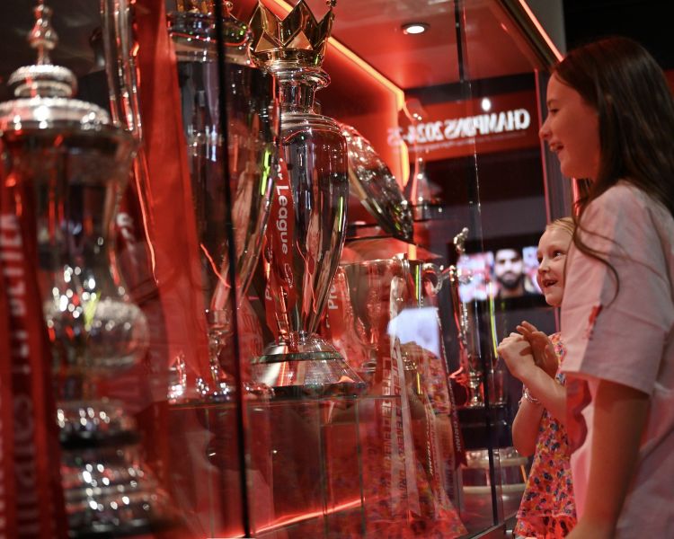 girls looking at trophies at the liverpool fc museum