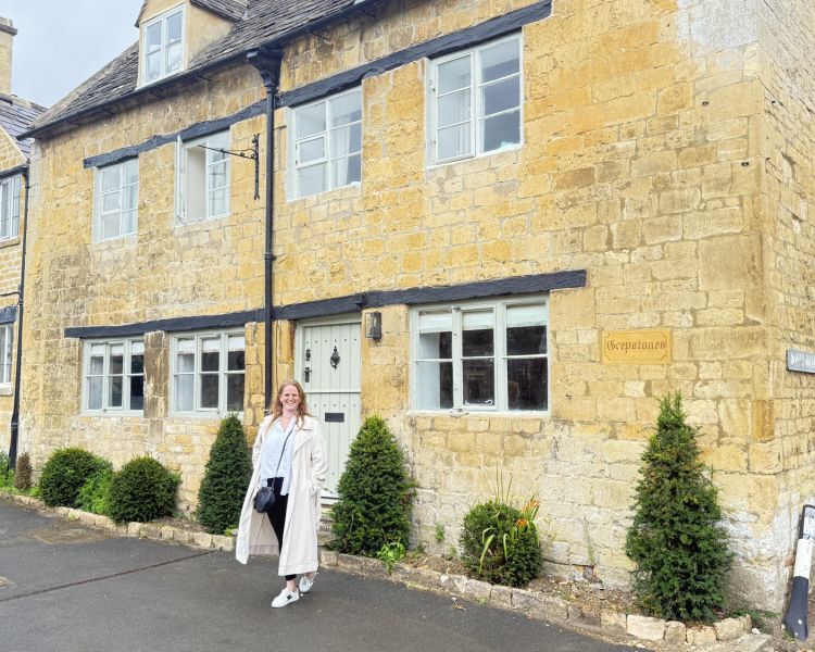 Woman in front of greystones house in blockley on father brown tour