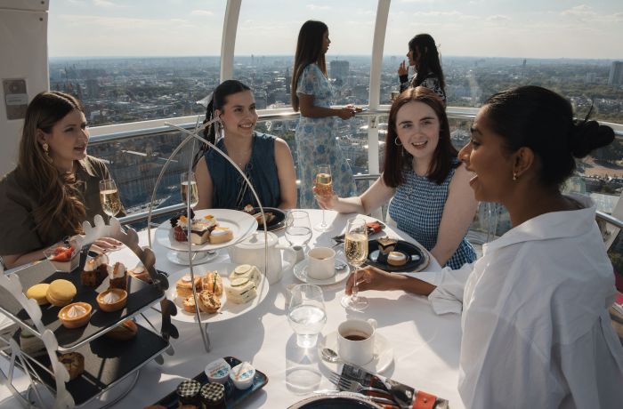 girls having afternoon tea in a london eye pod