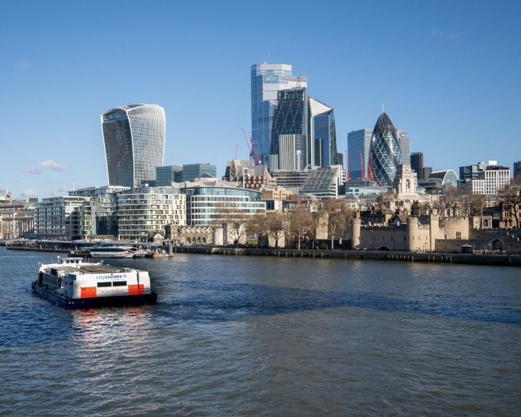 thames river cruise with city of london in background