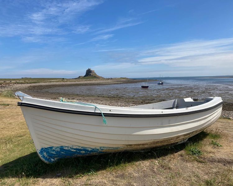 Coastal view of boats and castle seen on vera tour