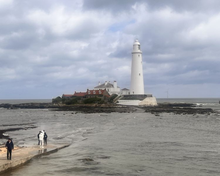Island with lighthouse on the coast seen on vera tour