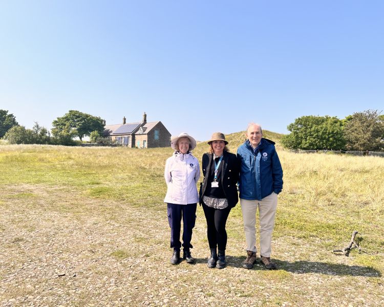 Three people having photo taken at vera location