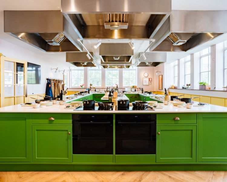 interior of jamie oliver cookery school showing cooking stations