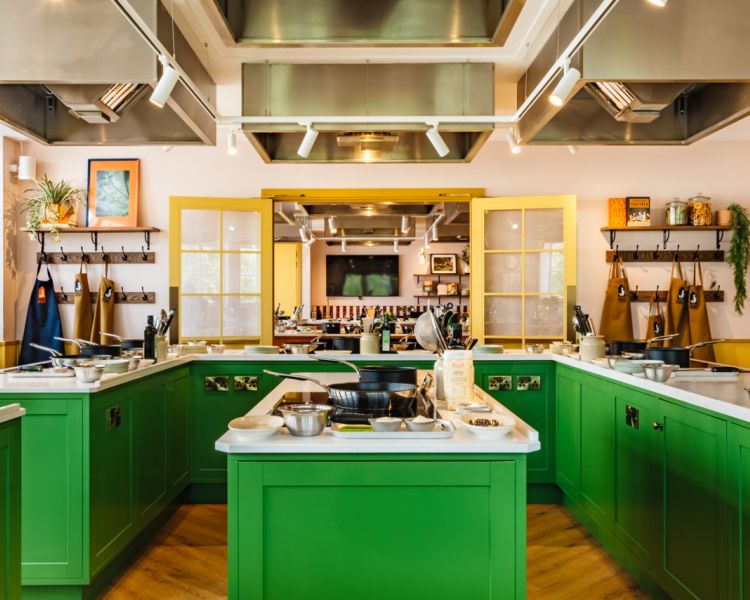 interior of jamie oliver cookery school showing cooking stations