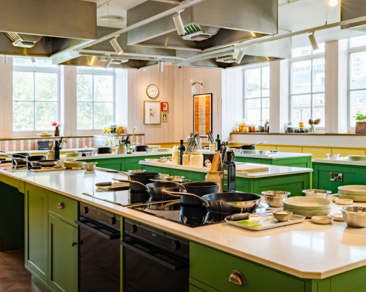 interior of jamie oliver cookery school showing cooking stations