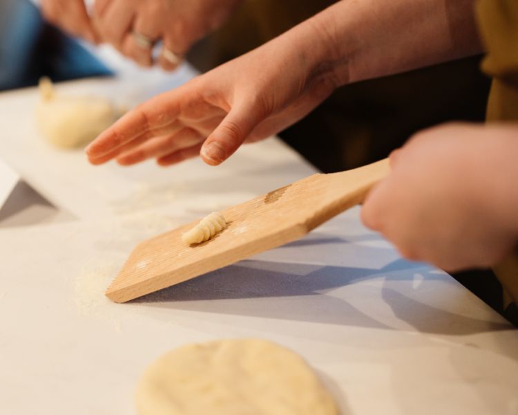 hand rolling fresh pasta shapes at jamie oliver cookery school in london