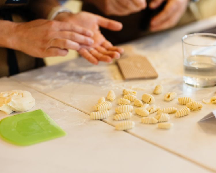 hand rolling fresh pasta shapes at jamie oliver cookery school in london