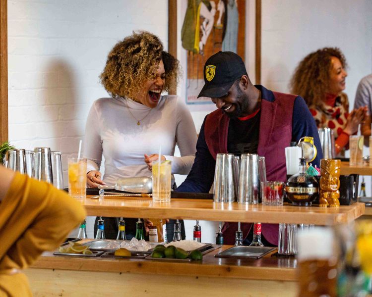 people laughing and having fun at cocktail class in london
