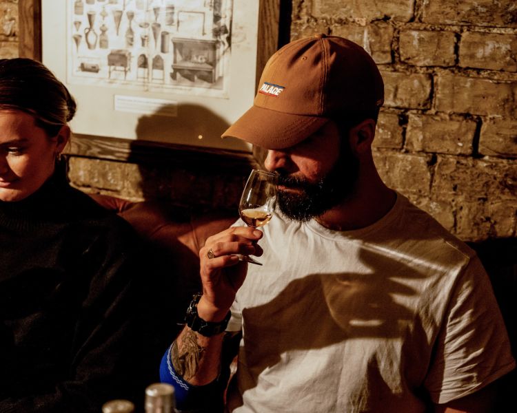 man smelling glass of whisky on a whisky tasting experience in london