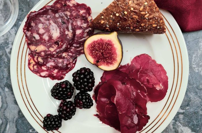 plate of charcuterie with fruit and bread made on a charcuterie making course with bray cured