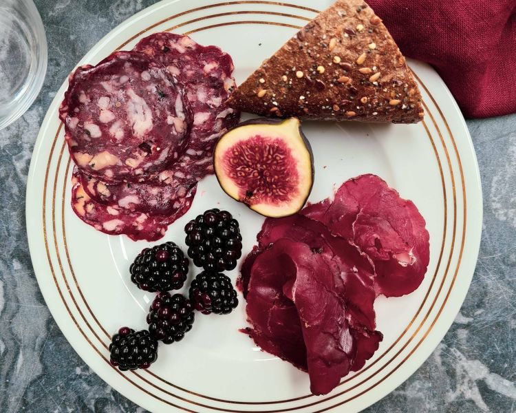 plate of charcuterie with fruit and bread made on a charcuterie making course with bray cured