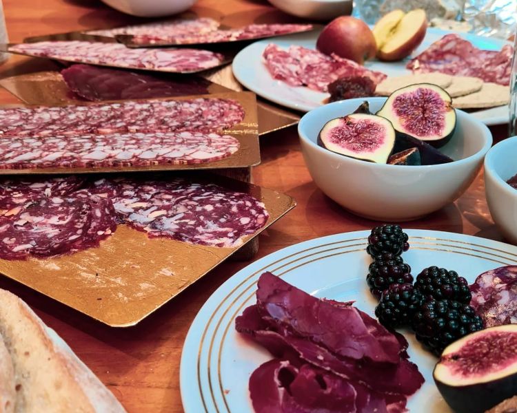 a selection of charcuterie with fruit and bread made on a charcuterie making course with bray cured